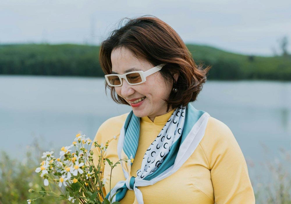 Perimenopausal woman holding flowers