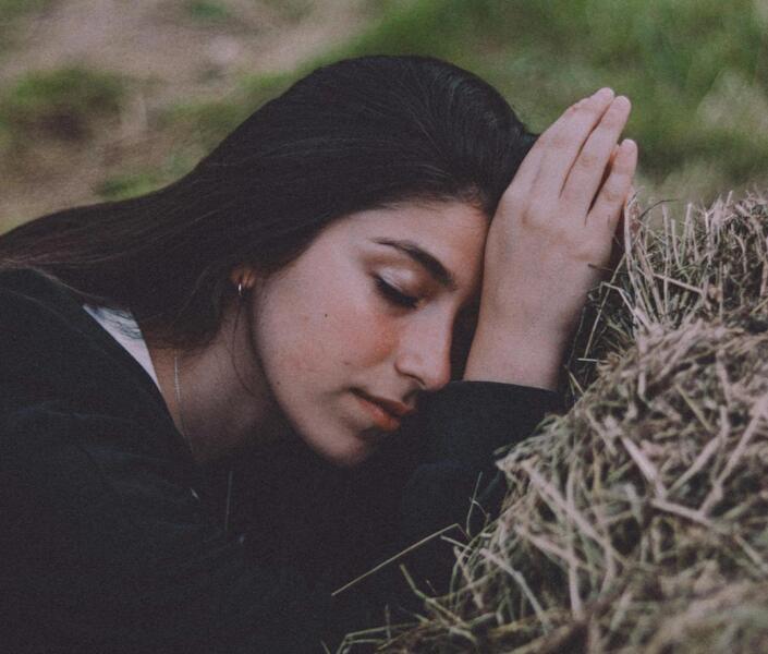 Woman laying on hay