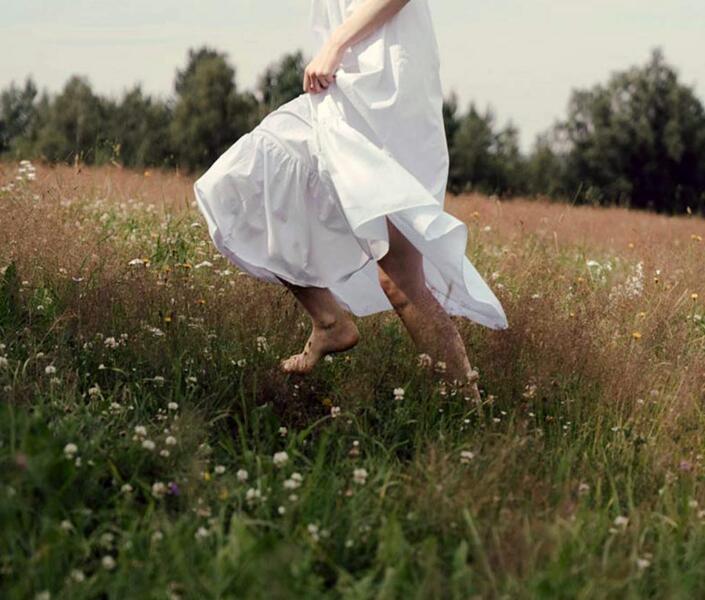 Women running through a field